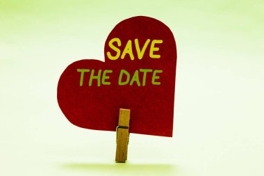 Writing note showing Save The Date. Business photo showcasing Systematized events Scheduled activity Recorded Filed Clothespin holding red paper heart important romantic message ideas. clipart