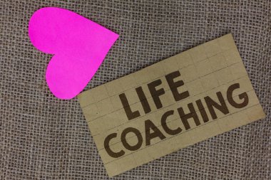 Word writing text Life Coaching. Business concept for Improve Lives by Challenges Encourages us in our Careers Piece squared paperboard paper heart jute background Communicating ideas. clipart