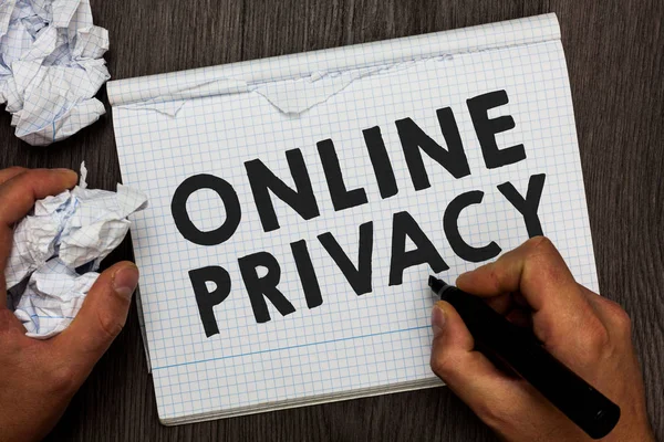 Writing note showing Online Privacy. Business photo showcasing Security level of personal data published via the Internet Man holding marker notebook crumpled papers several tries made.