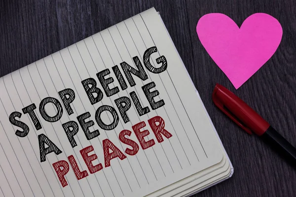 Writing note showing Stop Being A People Pleaser. Business photo showcasing Do what you like not things other people want Strikethrough words on notepad love heart pen on blackish woody desk. — Stock Photo, Image