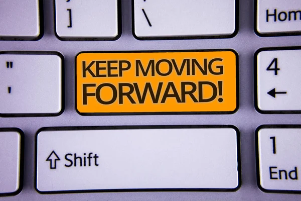 Handwriting text writing Keep Moving Forward Motivational Call. Concept meaning Optimism Progress Persevere Move Silver color polished modern computer keyboard with yellow arrow button.