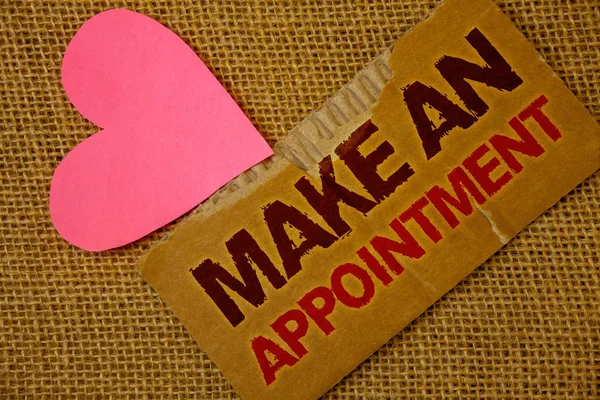 Word writing text Make An Appointment. Business concept for Schedule Arrangement Deadline Session Engagement Torn thick paper blood and pigment red texts jute sack pink paper heart.