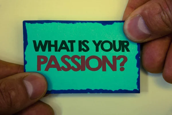 Writing note showing  WhatS Your Passion Question. Business photo showcasing asking someone about his dreams and hopes Greyish backstage man hand retain blue outskirts page showing words. — Stock Photo, Image