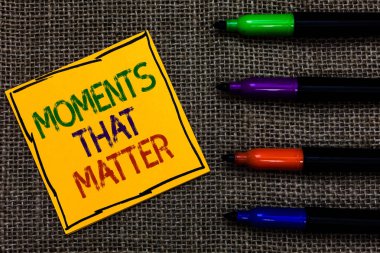 Conceptual hand writing showing Moments That Matter. Business photo text Meaningful positive happy memorable important times Written on black lined yellow transverse note pen jute ground clipart
