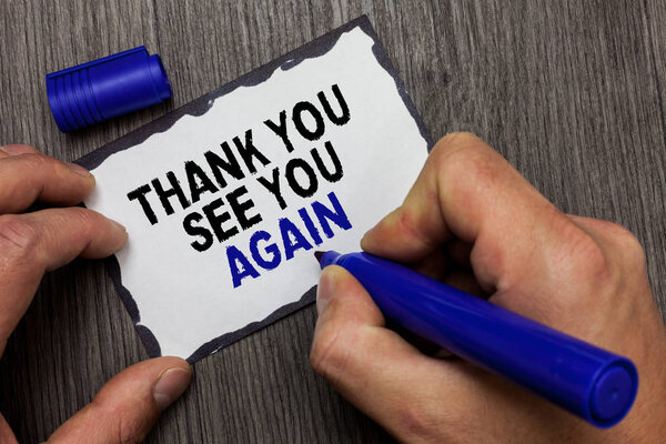 Handwriting text Thank You See You Again. Concept meaning Appreciation Gratitude Thanks I will be back soon Gray wooden deck hand hold black marker written black lined sticky note.