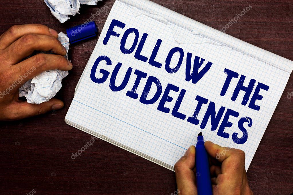 Writing note showing Follow The Guidelines. Business photo showcasing Manual of Style Follow a Specified Rule Accordingly Man holding marker notebook page crumpled paper several tries mistakes.