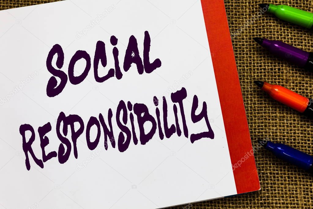 Handwriting text Social Responsibility. Concept meaning Obligation for the Benefit of Society Balance in life Open notebook page jute background colorful markers Expressing ideas.