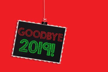 Handwriting text writing Goodbye 2019. Concept meaning New Year Eve Milestone Last Month Celebration Transition Hanging blackboard message communication information sign red background. clipart