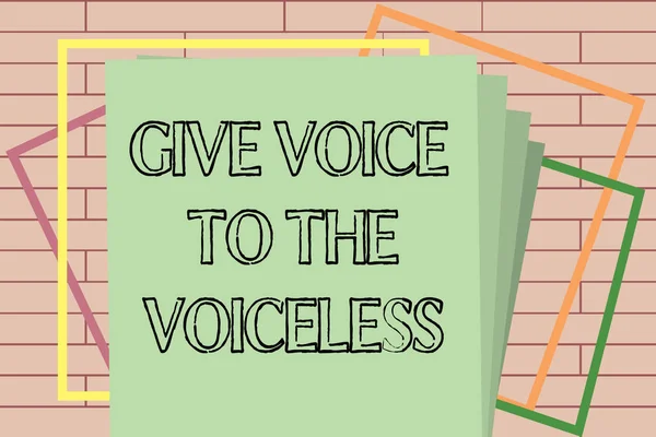 Handwriting text writing Give Voice To The Voiceless. Concept meaning Speak out on Behalf Defend the Vulnerable