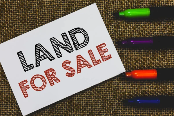 Handwriting text Land For Sale. Concept meaning Real Estate Lot Selling Developers Realtors Investment White Paper Important reminder Communicate ideas Markers Jute background.