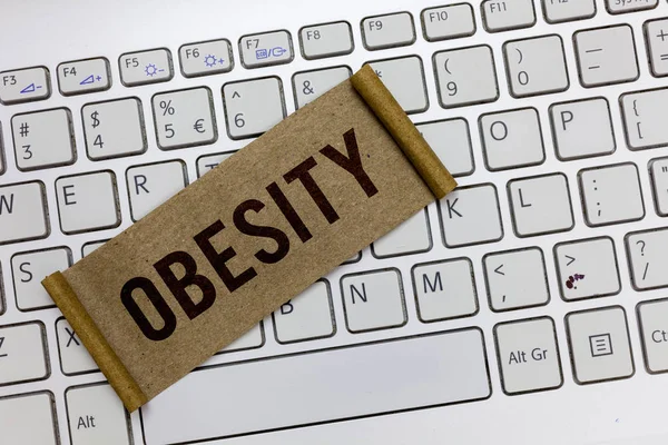 Handgeschreven tekst schrijven van obesitas. Begrip betekenis van medische aandoening overmaat van lichaamsvet geaccumuleerde gezondheidsprobleem — Stockfoto