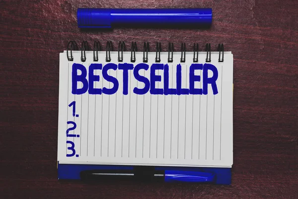 Conceptual hand writing showing Bestseller. Business photo text Book product sold in large numbers Successful literature Open notebook page marker communicating ideas wooden background