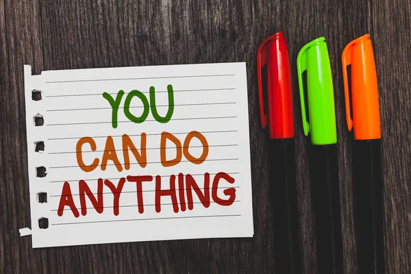 Handwriting text You Can Do Anything. Concept meaning Motivation for doing something Believe in yourself Colorful words with white page red green orange pen on blackish wooden desk. — Stock Photo, Image