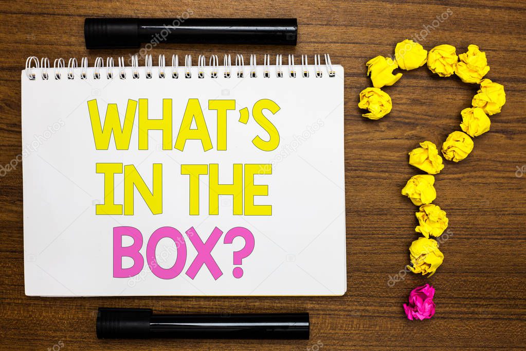 Conceptual hand writing showing What s is In The Box question. Business photo showcasing Curiosity Opening a gift Surprise package White page with bright color word black pen yellow paper lob.