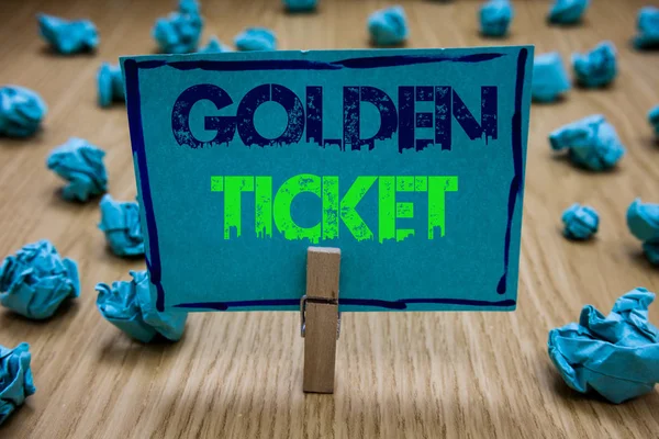 Handwriting text writing Golden Ticket. Concept meaning Rain Check Access VIP Passport Box Office Seat Event Clothespin holding blue paper note crumpled papers several tries mistakes.