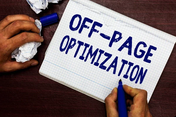 Writing note showing Off Page Optimization. Business photo showcasing Website External Process Promotional Method Ranking Man holding marker notebook page crumpled paper several tries mistakes.