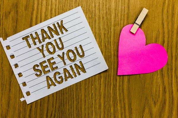 Conceptual hand writing showing Thank You See You Again. Business photo showcasing Appreciation Gratitude Thanks I will be back soon Yellow woody deck word with white page paper clip grip heart.