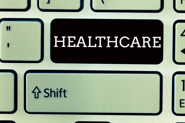 Text tecken visar hälso-och sjukvård. Konceptuella foto tillhandahållande av sjukvård till individer förbättra välbefinnande — Stockfoto
