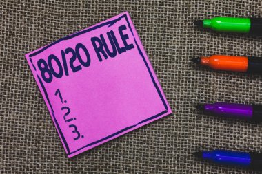 Conceptual hand writing showing 80 20 Rule. Business photo showcasing Pareto principle 80 percent effects come from 20 causes Purple Paper Important reminder Markers Jute background. clipart