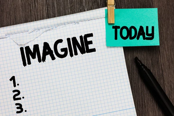 Conceptual hand writing showing Imagine. Business photo showcasing Form mental image or concept Suppose Assume Dream Inspiration Notebook holding reminder important message wood background. — Stock Photo, Image