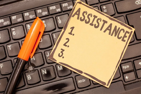 Conceptual hand writing showing Assistance. Business photo showcasing Helping someone Sharing work Give support Reinforcement — Stock Photo, Image