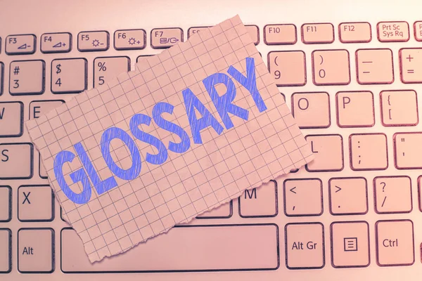 Writing note showing Glossary. Business photo showcasing alphabetical list of words relating to subject text or dialect — Stock Photo, Image