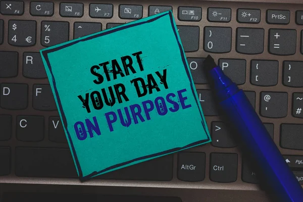 Text sign showing Start Your Day On Purpose. Conceptual photo Have clean ideas of what you are going to do Huge button with computer keyboard black lined written blue page marker pen.