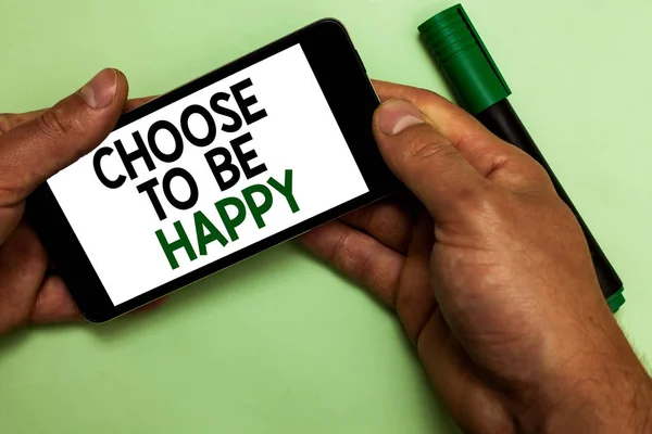 Writing note showing Choose To Be Happy. Business photo showcasing Decide being in a good mood smiley cheerful glad enjoy Human hand hold iPhone with texts touched green marker. — Stock Photo, Image