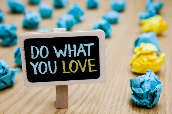Conceptual hand writing showing Do What You Love. Business photo text Make enjoyable things do activities with motivation poster board with blurry paper lobs laid serially mid yellow lob.