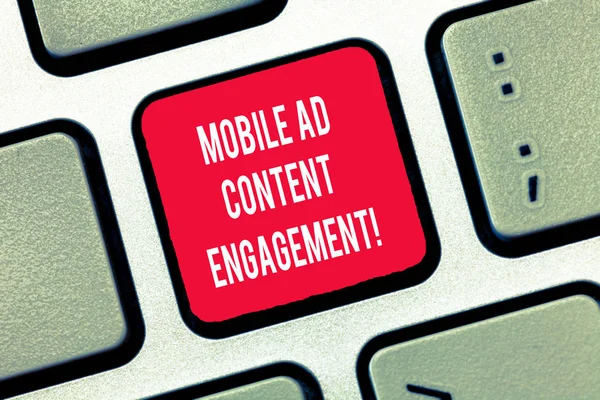 Writing note showing Mobile Ad Content Engagement. Business photo showcasing Social media advertising promotion strategies Keyboard Intention to create computer message keypad idea. — Stock Photo, Image