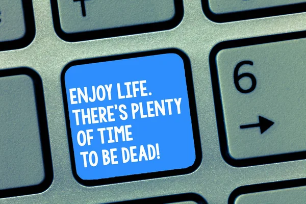 Handwriting text writing Enjoy Life There S Is Plenty Of Time To Be Dead. Concept meaning Be happy while you are alive Keyboard key Intention to create computer message, pressing keypad idea.