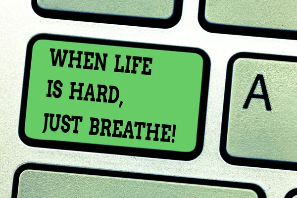 Text sign showing When Life Is Hard Just Breathe. Conceptual photo Take a break to overcome difficulties Keyboard key Intention to create computer message pressing keypad idea. — Stock Photo, Image