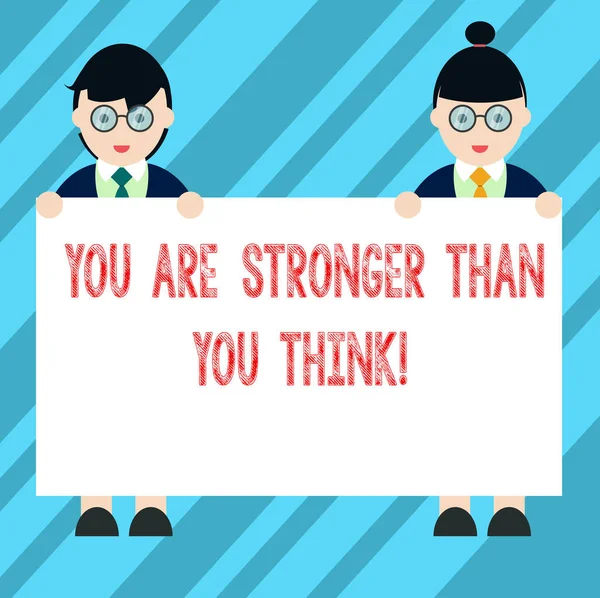 Text sign showing You Are Stronger Than You Think. Conceptual photo Adaptability Strength to overcome obstacles Male and Female in Uniform Standing Holding Blank Placard Banner Text Space.
