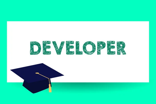 Text sign showing Developer. Conceptual photo demonstrating or thing that develops grows or matures something Graduation hat with Tassel Scholar Academic cap Headgear for Graduates. — Stock Photo, Image