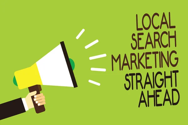 Conceptual hand writing showing Local Search Marketing Straight Ahead. Business photo showcasing answering to someone about destination Man holding megaphone green background message speaking loud.