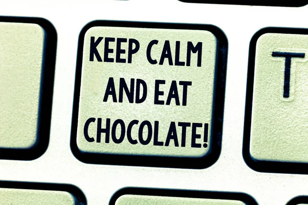 Text sign showing Keep Calm And Eat Chocolate. Conceptual photo Everything is better when you are eating sweets Keyboard key Intention to create computer message pressing keypad idea.