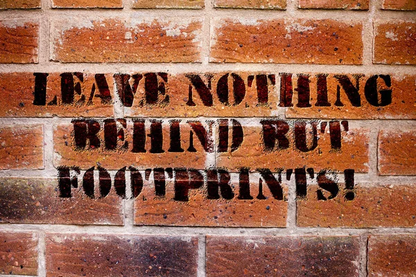 Conceptual hand writing showing Leave Nothing Behind But Footprints. Business photo text Do not look back always go forward. — Stock Photo, Image