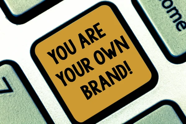 Text sign showing You Are Your Own Brand. Conceptual photo Perception emotion from other showing about yourself Keyboard key Intention to create computer message pressing keypad idea.