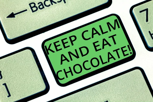 Handwriting text Keep Calm And Eat Chocolate. Concept meaning Everything is better when you are eating sweets Keyboard key Intention to create computer message pressing keypad idea.