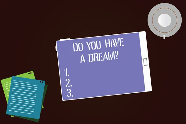 Escribiendo una nota mostrando Do You Have A Dreamquestion. Exhibición de fotos de negocios Cuéntenos cuáles son sus metas y expectativas Platillo de la taza de la pantalla de la tableta y hojas de relleno en el fondo del color . — Foto de Stock