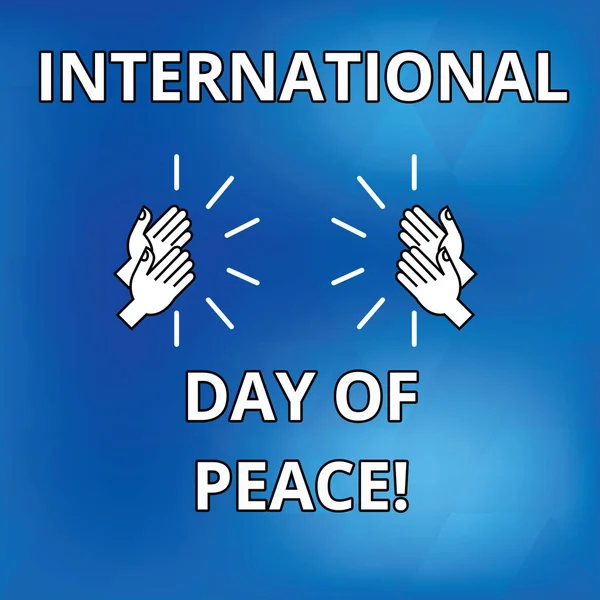 Text sign showing International Day Of Peace. Conceptual photo Worldwide peaceful celebration Hope freedom Drawing of Hu analysis Hands Clapping Applauding Sound icon on Blue Background.