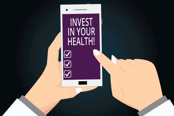 Writing note showing Invest In Your Health. Business photo showcasing Spend money in demonstratingal healthcare Preventive Tests Hu analysis Hands Holding Pointing Smartphone Blank Color Screen. — Stock Photo, Image