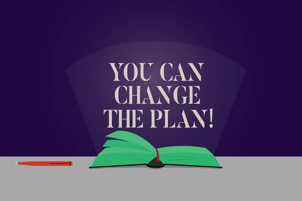 Word writing text You Can Change The Plan. Business concept for Make changes in your plans to accomplish goals Color Pages of Open Book photo on Table with Pen and Light Beam Glaring.