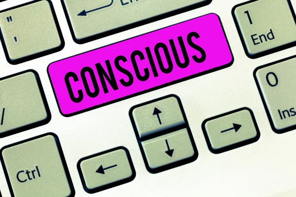 Conceptual hand writing showing Conscious. Business photo showcasing aware of and responding to ones surroundings using his senses Keyboard Intention to create computer message keypad idea.