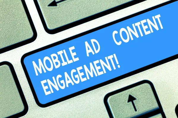 Handwriting text Mobile Ad Content Engagement. Concept meaning Social media advertising promotion strategies Keyboard key Intention to create computer message pressing keypad idea.