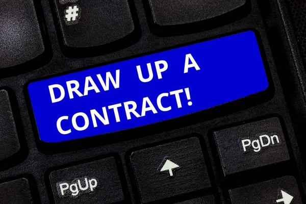 Text sign showing Draw Up A Contract. Conceptual photo Write a business agreement cooperation legal papers Keyboard key Intention to create computer message pressing keypad idea.