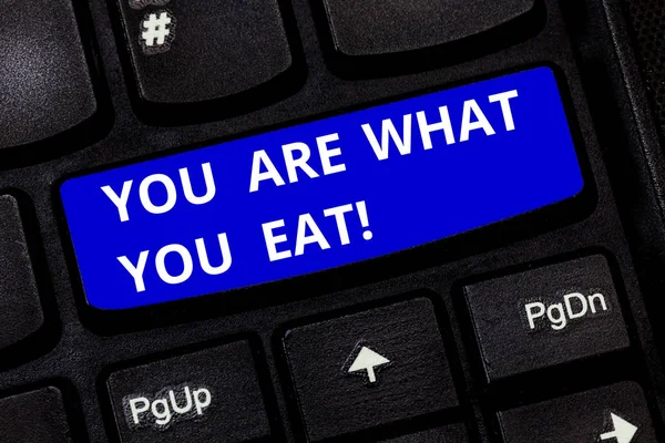 Text sign showing You Are What You Eat. Conceptual photo Have a healthy lifestyle take care of your foods Keyboard key Intention to create computer message pressing keypad idea. — Stock Photo, Image