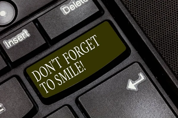 Word writing text Don T Forget To Smile. Business concept for Be always cheerful smiley spread and show happiness Keyboard key Intention to create computer message pressing keypad idea.