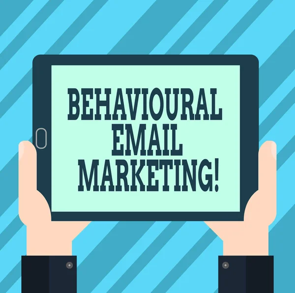 Text sign showing Behavioural Email Marketing. Conceptual photo customercentric trigger base messaging strategy Hu analysis Hand Holding Blank Screen Tablet Smartphone Display Unit photo.