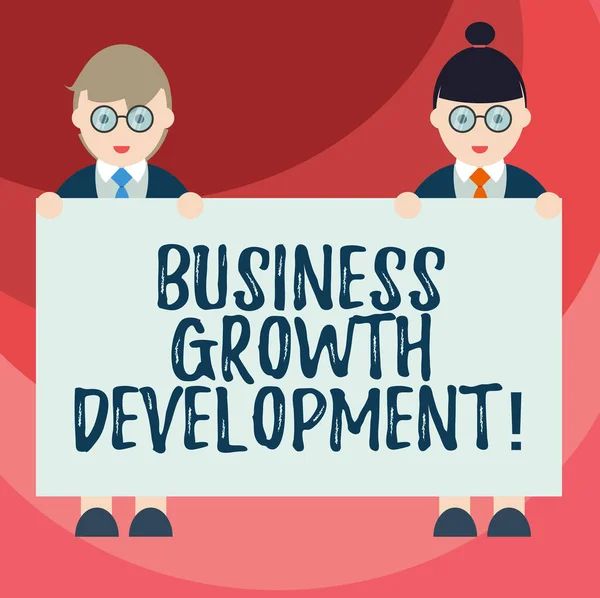 Text sign showing Business Growth Development. Conceptual photo improving some measure of an enterprise success Male and Female in Uniform Standing Holding Blank Placard Banner Text Space. — Stock Photo, Image